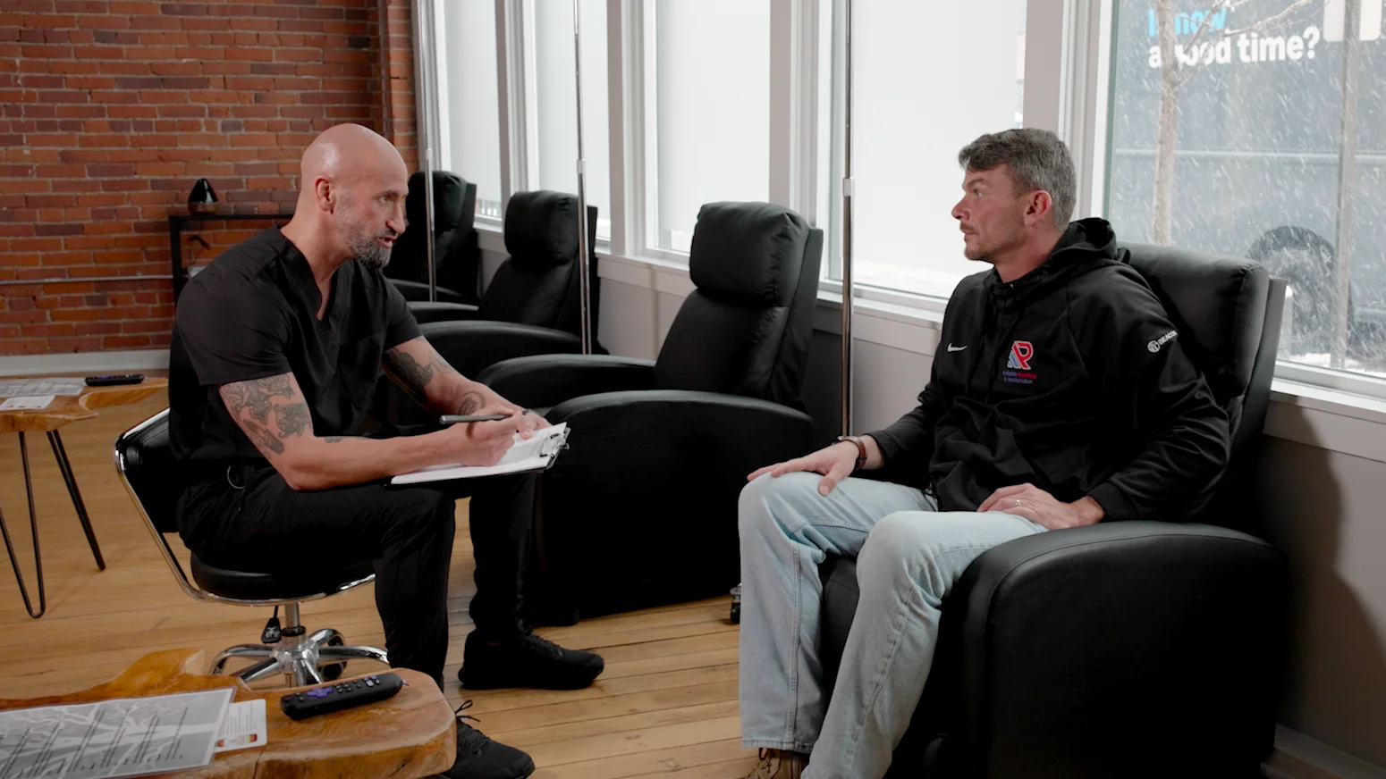 Rick in conversation with a client at Vitality Lounge