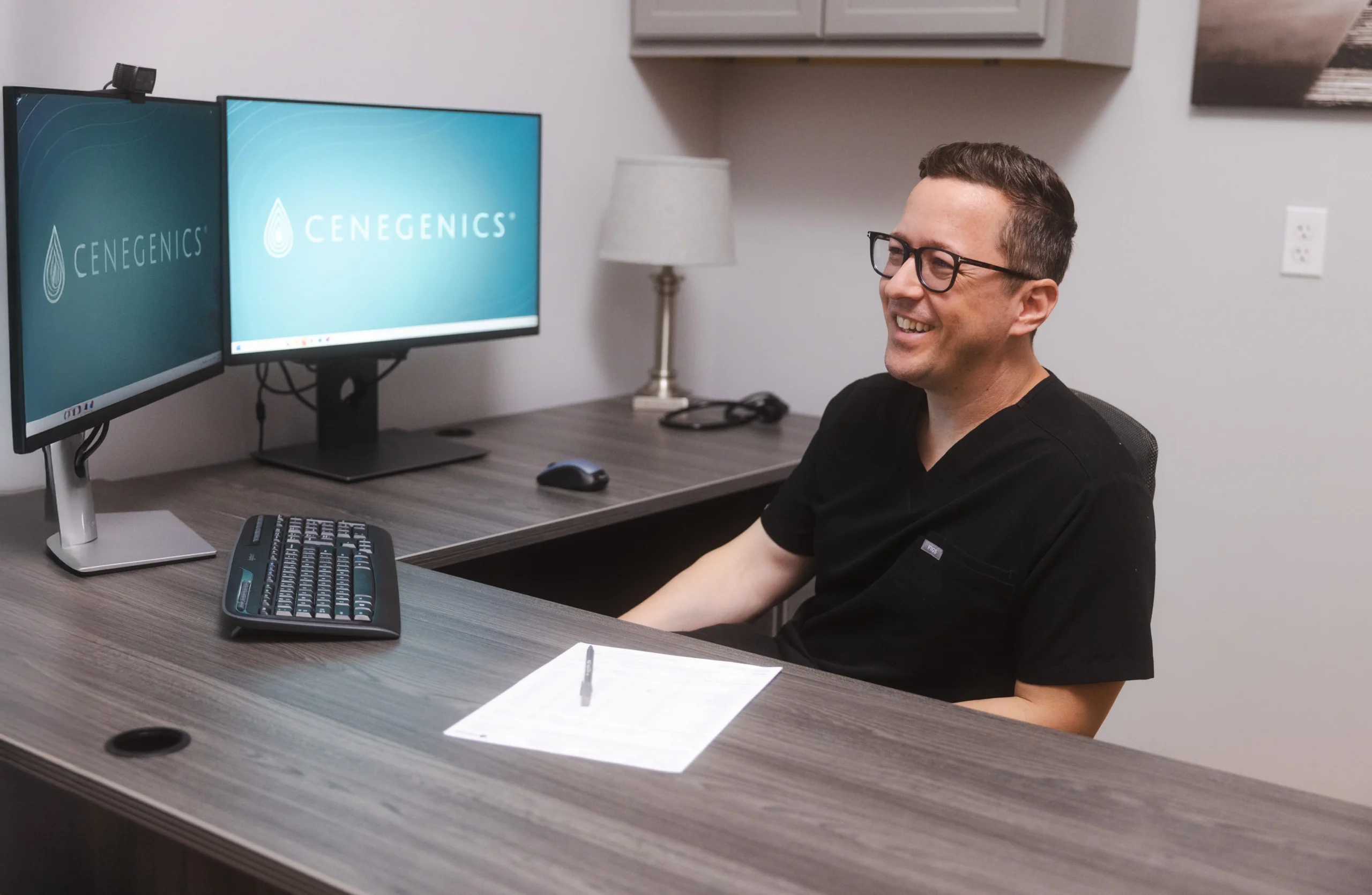 Reviewing a member's health dashboard on dual monitors
